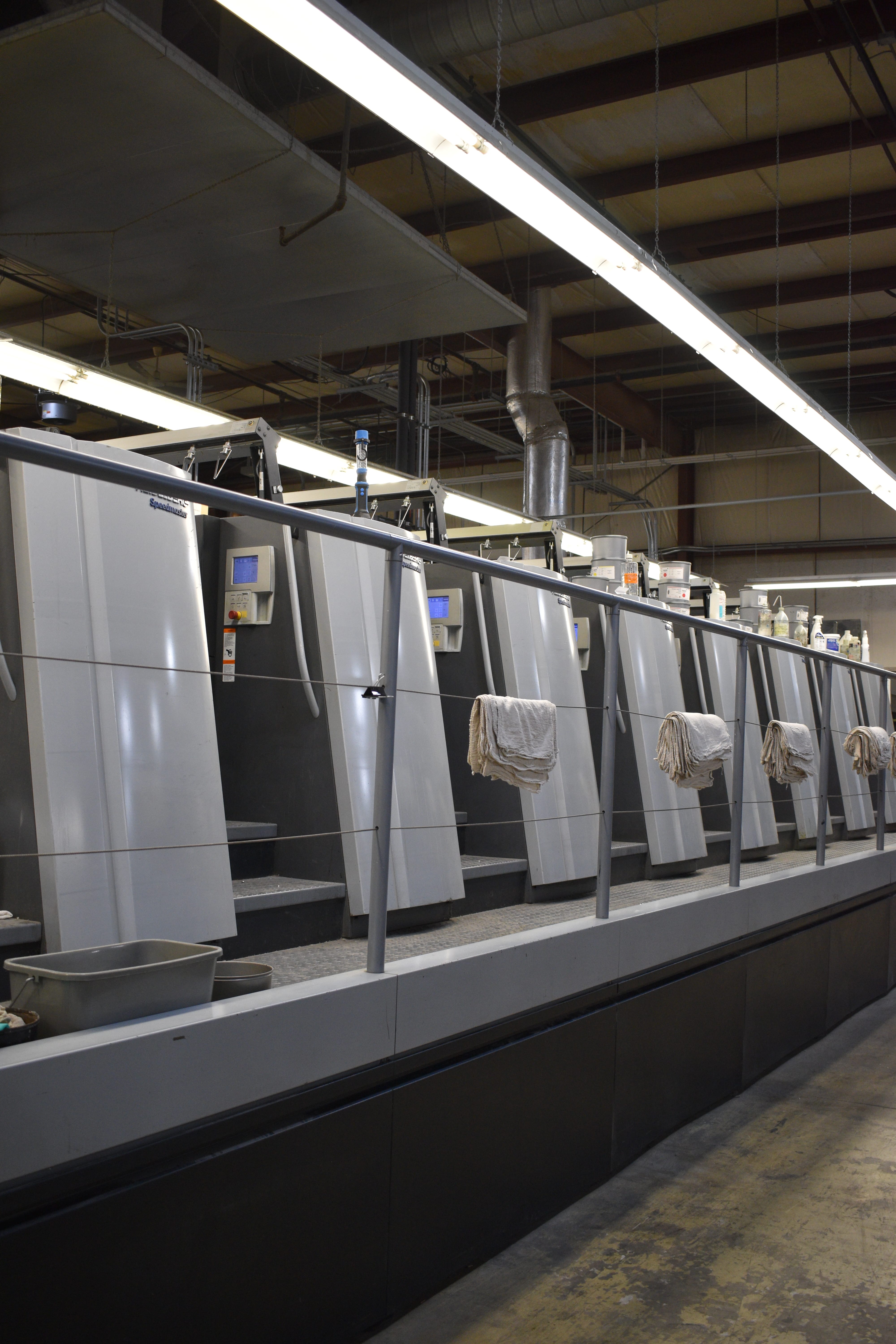 Commercial offset printing press in operation
